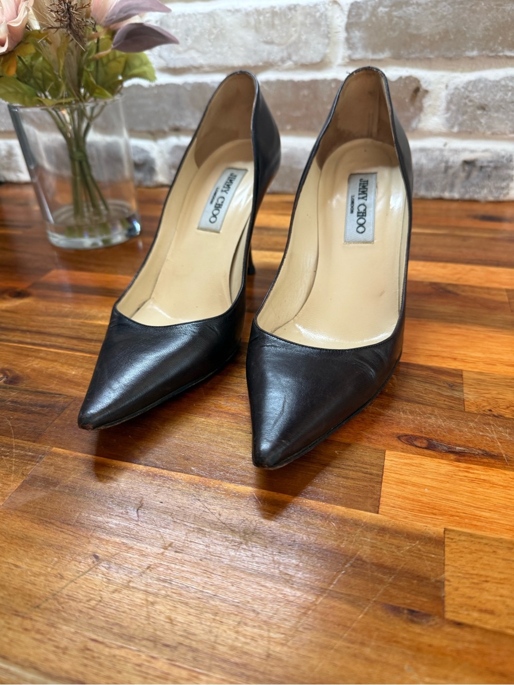 Jimmy Choo Black Leather Pointed Pumps with Classic Silhouette